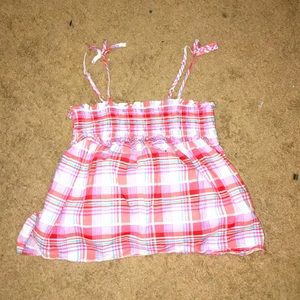 I am selling a pink plaid again puffy tank shirt!
